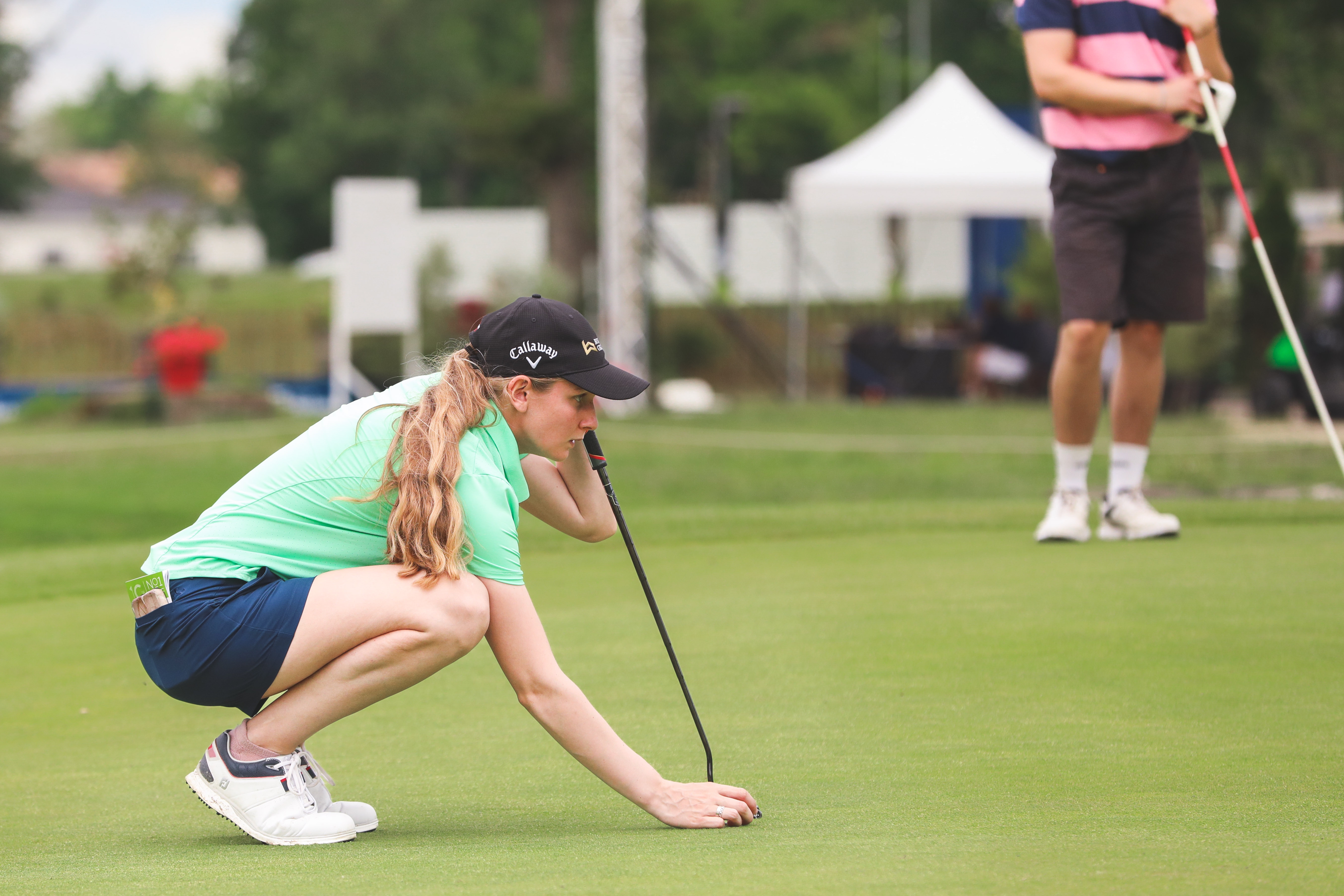 Emily Price lines up a putt